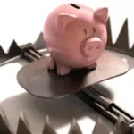 Sparschwein in einer Falle