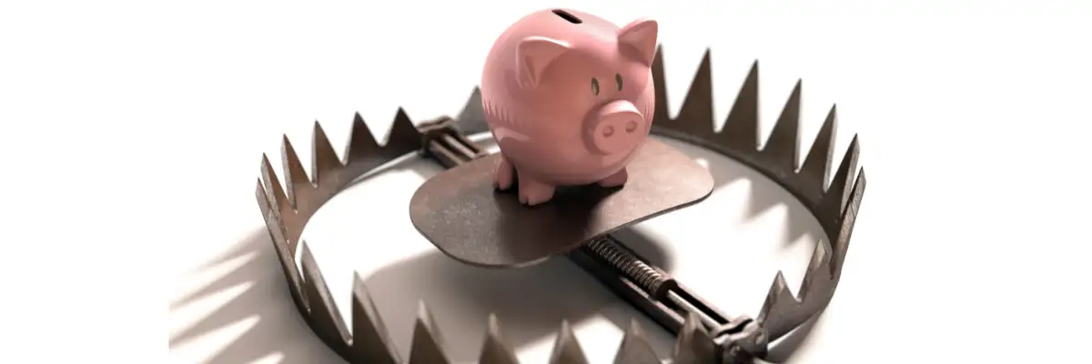 Sparschwein in einer Falle